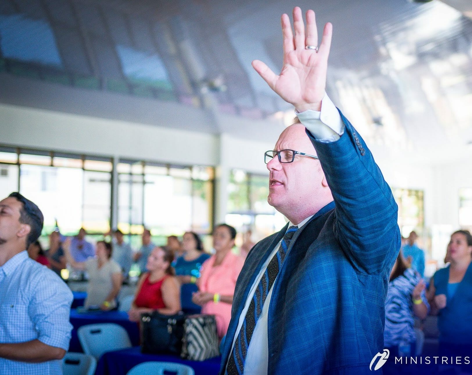 Josh Lingel worshipping with students.